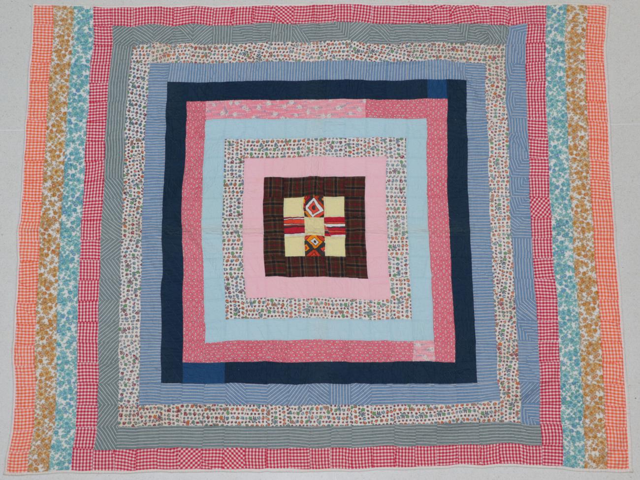 Circa 1950 African American Patchwork Quilt, incorporating bright decoratively coloured printed,