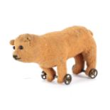 Early 20th Century Miniature Bear on Wheels, with boot button eyes, in brown worn plush, stitched