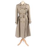 Burberrys Lady's Belted Double Breasted Trench Coat, lined in signature check cotton. 36'' bust,