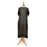 Circa 1920s Black Chiffon Dress, with short sleeves, scooped neckline and stripes of beaded