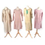 Four 1920s Day Dresses, comprising a dark cream collared dress, with button down details and