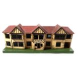 Circa 1930s Large Triang Dolls House, built in the Tudor style, 115cm long by 27cm depth by 43cm