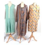 Three 1920s Day Dresses, comprising a turquoise silk sleeveless dress with scalloped edge to the