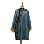 Early 20th Century Chinese Blue Figured Silk Jacket, with embroidered floral appliqués to the hem,