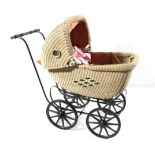 Circa 1930s Wicker Stylised Childs Pram, painted cream with circular coloured glass apertures to the