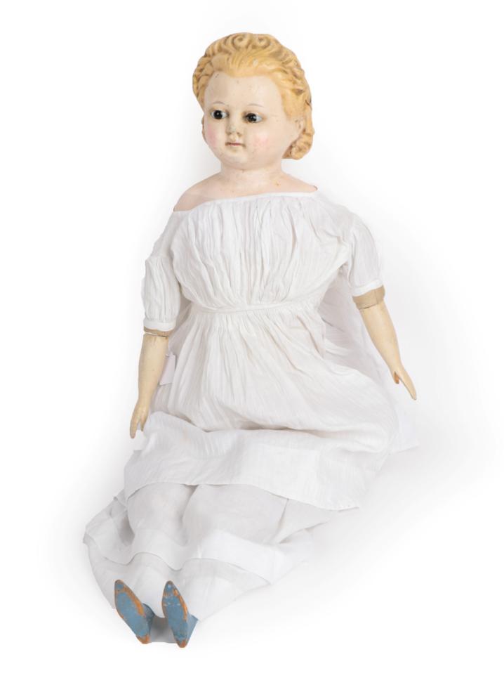 Circa 1869 Wax Over Pumpkin Head Doll, with moulded blond hair, glass eyes, painted cheeks and lips,