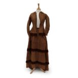 A Victorian Brown Silk Bustle Back Two Piece, comprising a fitted long sleeved jacket with multi