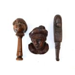 A German Treen Nutcracker, late 19th century, in the form of a caricature peasant's head on a