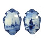 A Pair of De Porcelyne Fles Delft Wall Plaques, 20th century, of asymmetrically cartouche form,