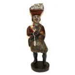 A Carved and Painted Wood Tobacconist Advertising Figure, modelled as a Highlander in traditional