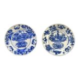 A Pair of Chinese Porcelain Plates, Kangxi, painted in underglaze blue with a basket of flowers