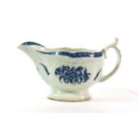 A Worcester Porcelain Sauce Boat, circa 1770, printed in underglaze blue with The Strap Flute Floral
