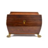 An Early 19th Century Rosewood Tea Caddy, of rounded sarcophagus form, with box strung edges, the