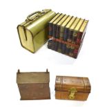 A Huntley & Palmer's Biscuit Tin, early 20th century, in the form of eight books tied by a strap,