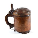A Scandinavian Burr Wood Peg Tankard, 18th century, with lion thumbpiece and carved roundel to the