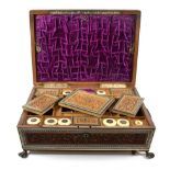 An Indian Sandalwood and Sadeli Dressing Table Box, 19th century, of rectangular form, carved with