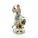 A Derby Porcelain Figure of Diana, circa 1770, the standing huntress holding a bow, her dog at her