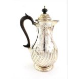 A Victorian Silver Hot-Water Jug, by Henry Atkin, Sheffield, 1892, pear-shaped and on spreading