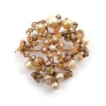 A Diamond and Pearl Floral Plaque Brooch, the various sized pearls set with old cut diamonds in a