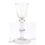 A Wine Glass, circa 1750, the rounded funnel bowl on a double knopped plain stem and turned foot,