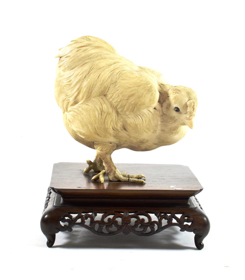 A Japanese Ivory Model of a Chicken, Meiji period, naturalistically modelled standing on a