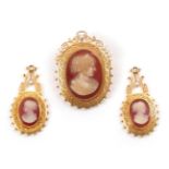 A Cameo and Pearl Brooch, measures 3.2cm by 4.4cm, and A Pair of Earrings, en suite (without