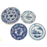 An English Delft Plate, circa 1750, painted in blue with a chinoiserie figure in a fenced garden