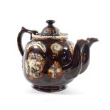 A Measham Bargeware Twin-Spouted Teapot and Cover, circa 1890, of ovoid form, inscribed MISS E