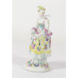 A Bow Porcelain Figure of a Girl, circa 1765, standing wearing a floral dress, on a mound base, 15.