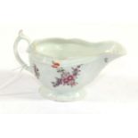 A Worcester Porcelain Sauce Boat, circa 1770, painted with flower sprays and scattered sprigs on a