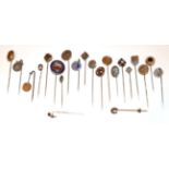 Twenty-Two Stick Pins, including a ruby diamond and pearl example, a garnet and split pearl example,