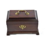 A George III Mahogany Tea Caddy, the domed hinged top with brass handle, on a rectangular base and