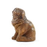 A Black Forest Carved Wood Figure of a Pekinese, late 19th/early 20th century, naturalistically
