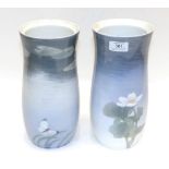 A Matched Pair of Royal Copenhagen Porcelain Vases, 20th century, decorated with foliage on a pale