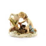 A Meissen Outside Decorated Porcelain Figure Group, late 19th century, as two cherubs laying bricks,