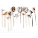 Twelve Stick Pins; including a diamond set bird example, cased, four bug examples, a snake head, a