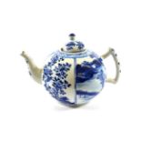 A Chinese Porcelain Teapot, Kangxi, painted in underglaze blue with panels of landscapes and