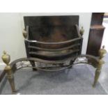 A George III Style Brass and Steel Fire Basket, of serpentine form with urn shaped finials, pierced