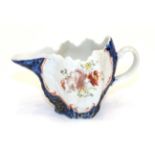 A West Pans Porcelain Cream Jug, circa 1765, of leaf moulded oval form, painted with flower sprays