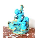 A Sèvres Style Turquoise Ground Figural Lamp Base, 19th century, modelled as two putti riding on a