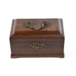 A George III Mahogany Tea Caddy, the domed cover with shell and scroll cast handle on a