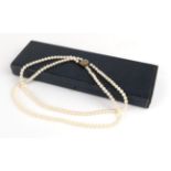 A Cultured Pearl Double Row Necklace with Mourning Clasp, the part knotted strings of pearls to an