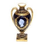 A Coalbrookdale Porcelain Commemorative Vase, circa 1850, of twin-handled urn shape, with pâte-sur-