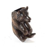 A Black Forest Wooden Wall Pocket, early 20th century, as a seated bear with glass eyes, 17.5cm