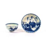 A Worcester Porcelain Tea Bowl and Saucer, circa 1765, painted in underglaze blue with The