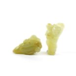 A Chinese Jade Carving of a Fruit, 5.5cm long; and A Similar Carving of a Boy, carrying flowers, 5.