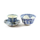 A Chinese Porcelain Octagonal Tea Bowl and Saucer, Kangxi, painted in underglaze blue with panels of