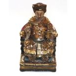A Chinese Lacquered, Painted and Giltwood Figure of a Dignitary, in Ming style, sitting wearing