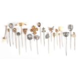 Twenty-One Stick Pins; including one with a tooth suspended, cased, silver examples, a fairy