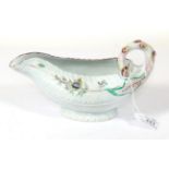A Worcester Porcelain Cos Lettuce Leaf Sauceboat, circa 1755, painted with flower sprays and sprigs,